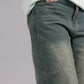 Close-up of blue jeans on a plain background