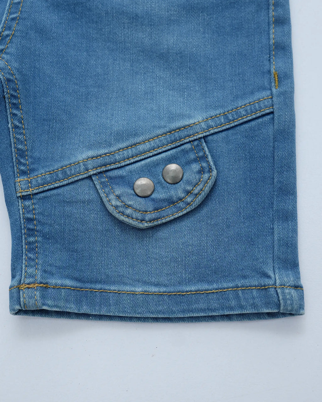 Close up of a boys’ denim shorts