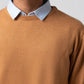 Upper body close up showing neckline and fabric of mustard sweater
