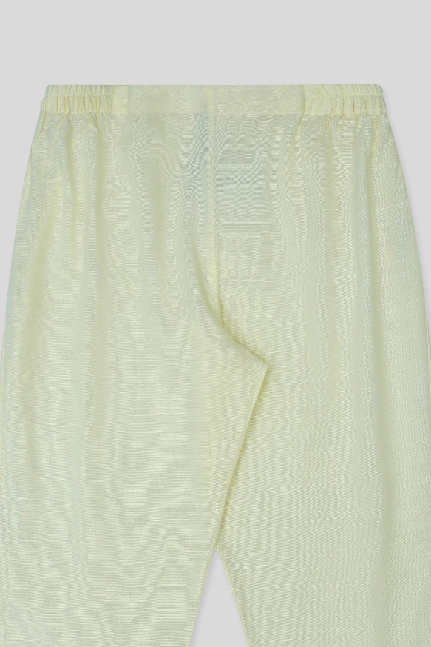 Cream cigarette pants close up