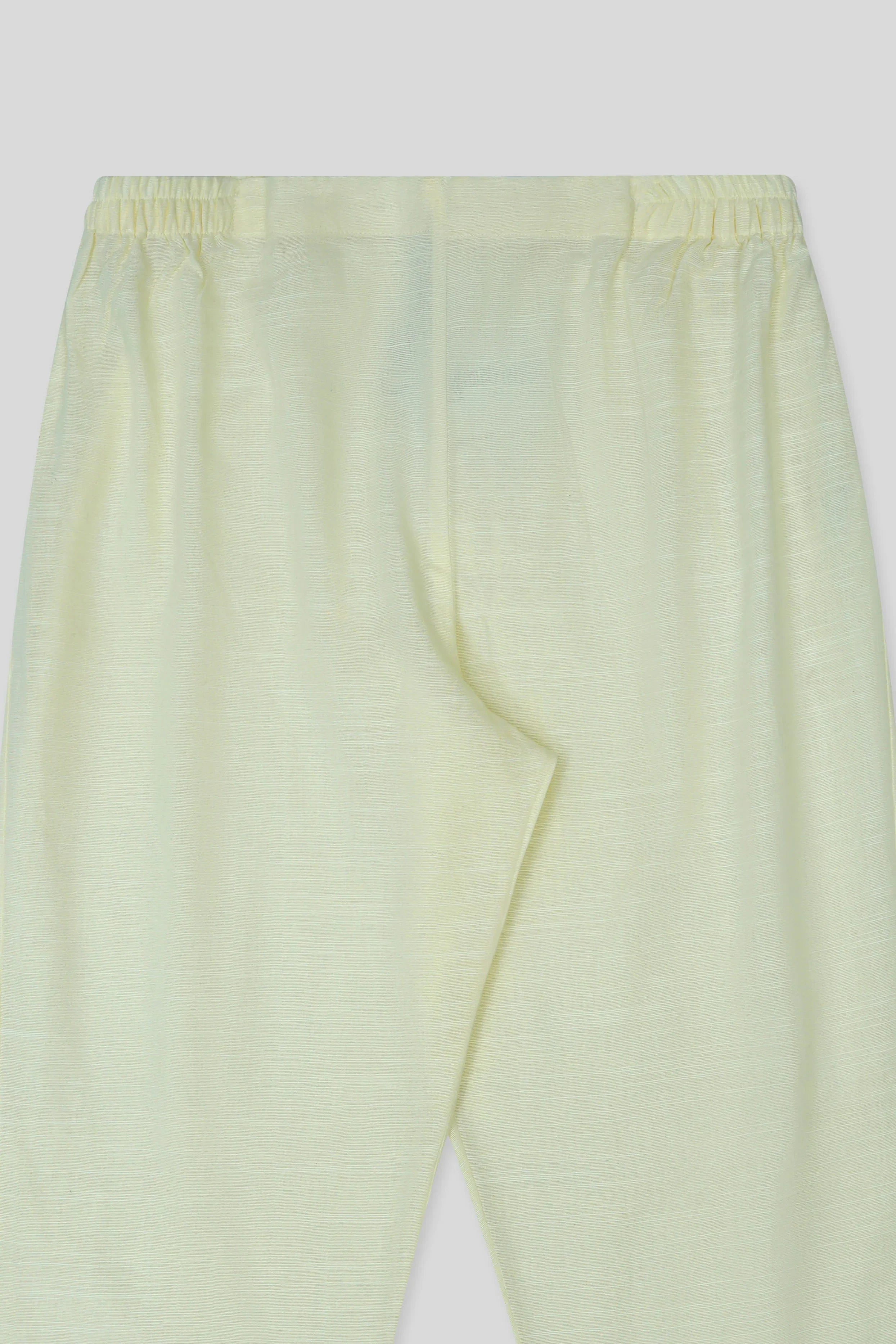 Cream cigarette pants close up
