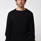 Crew neck cable knit sweater black front view worn by model