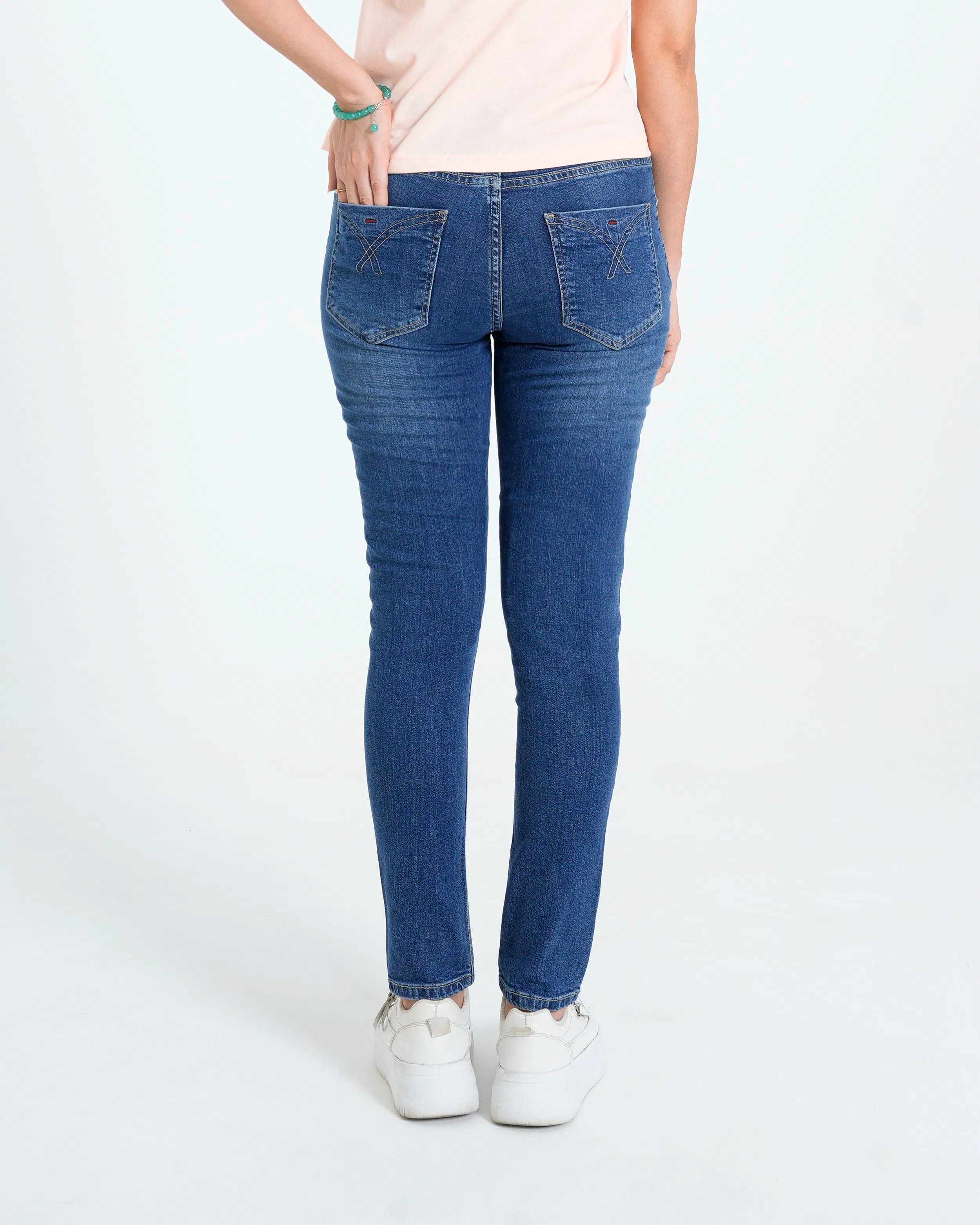 Dark blue denim jeans back view