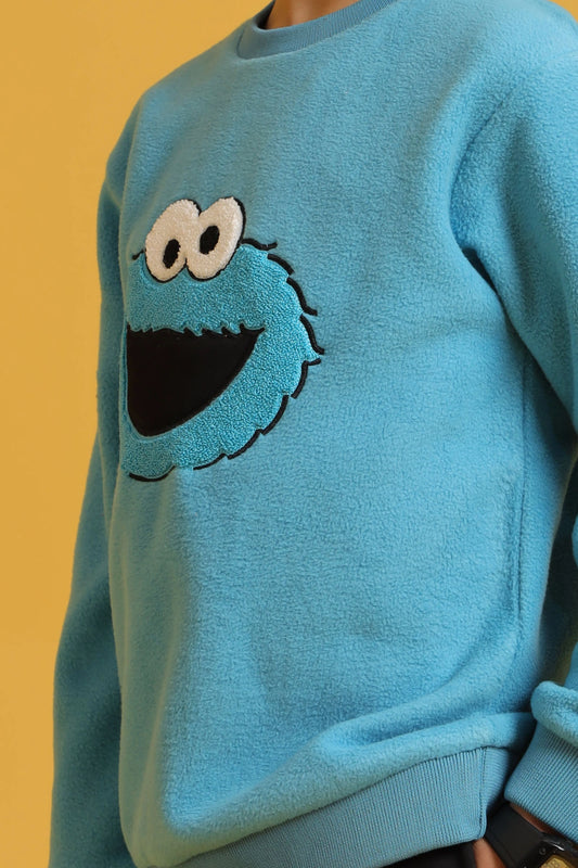 Embroidered character detail on boys' blue sweatshirt