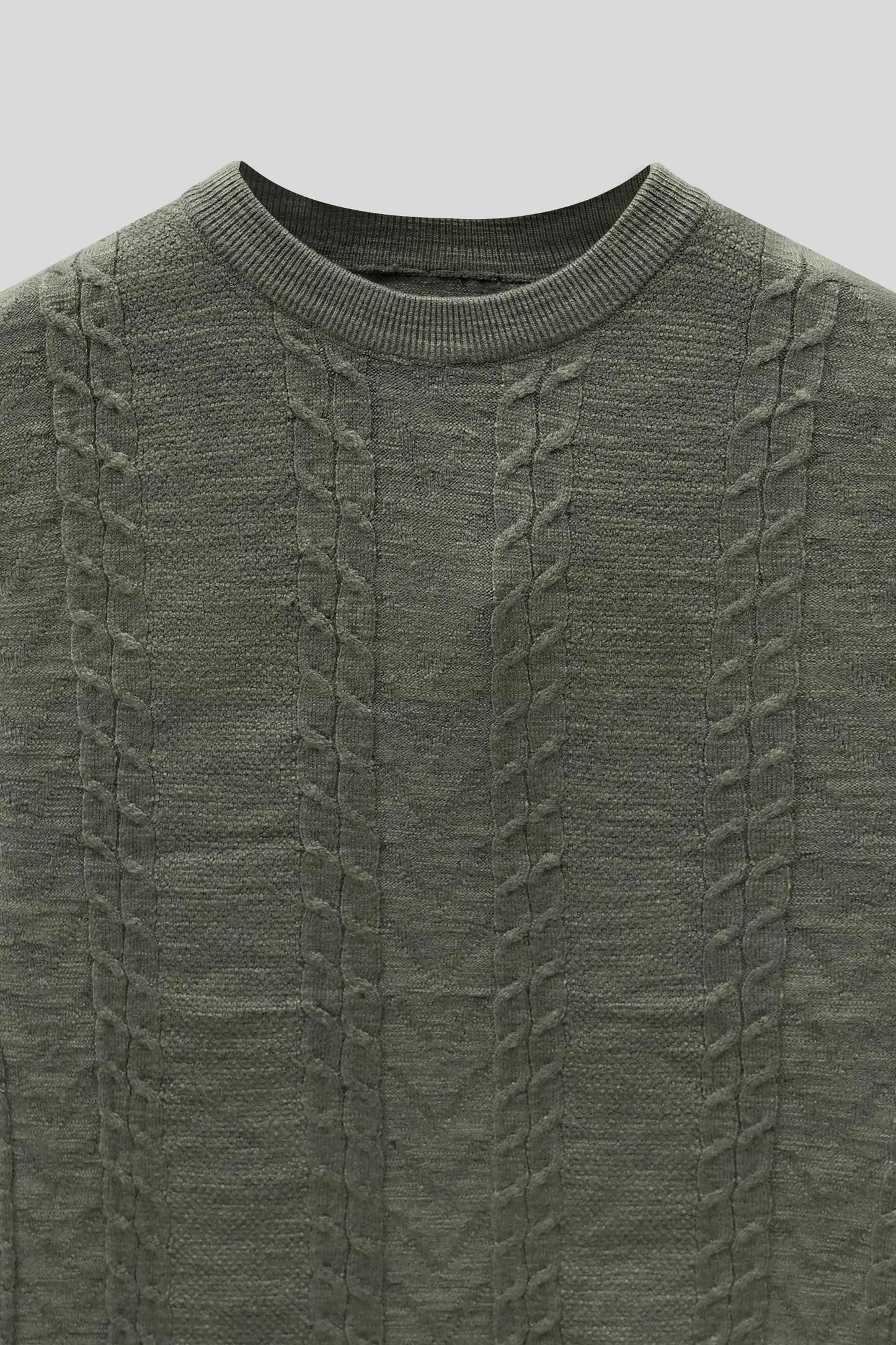 Fabric close up highlighting the knit texture of the wool cardigan olive