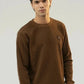 Upper-body front pose highlighting the brown sweatshirt fabric and fit