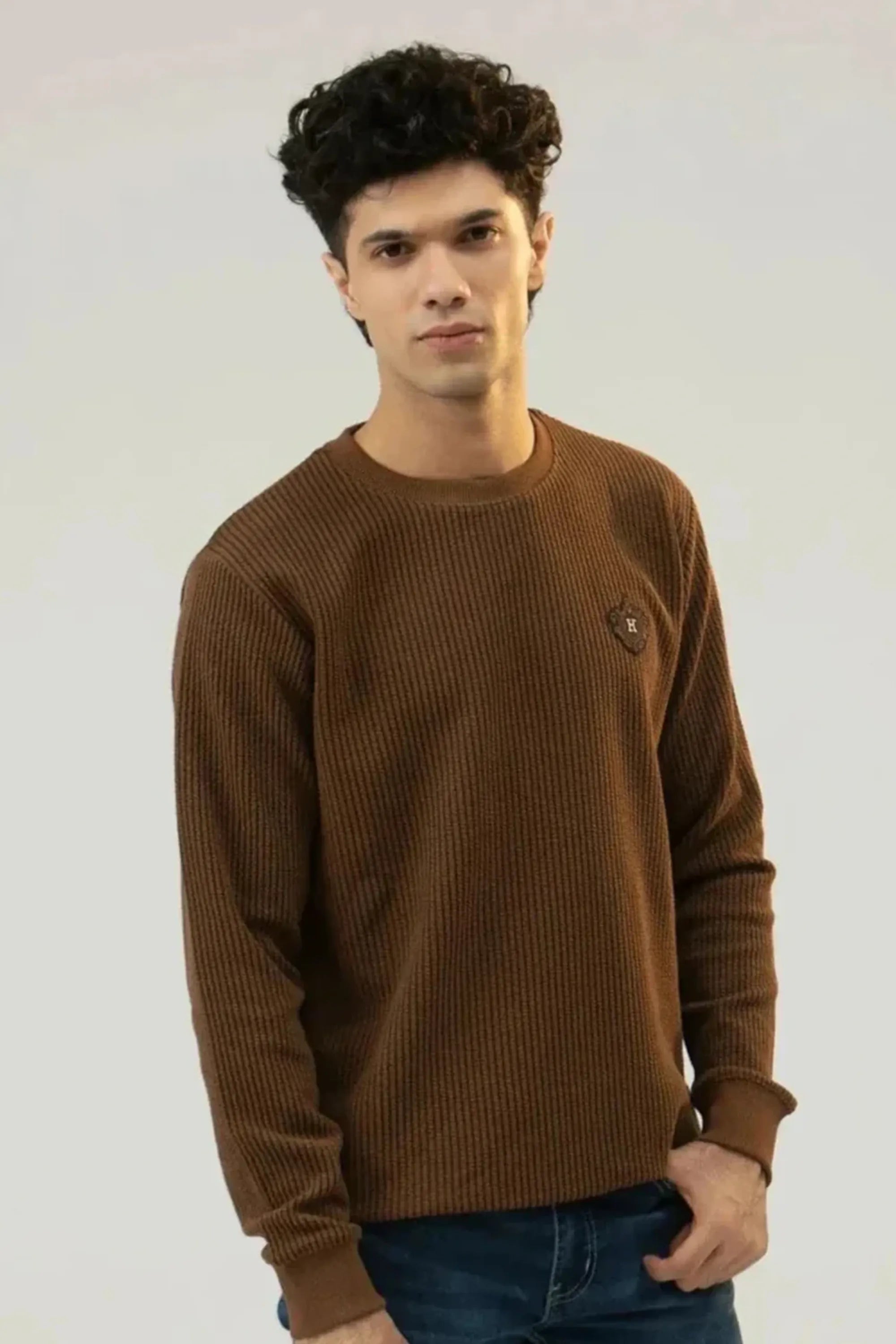 Upper-body front pose highlighting the brown sweatshirt fabric and fit