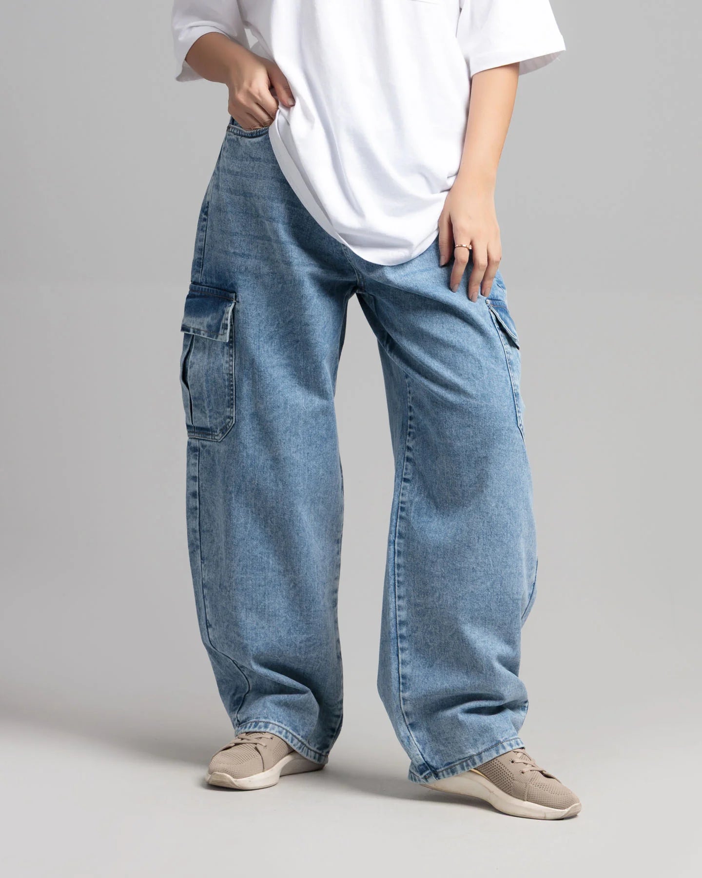 Front view of women’s ice blue skater fit cargo denim jeans