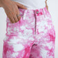 Fuchsia tie-dye jeans close up