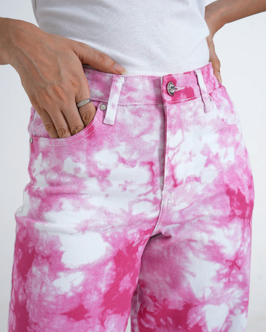 Fuchsia tie-dye jeans close up