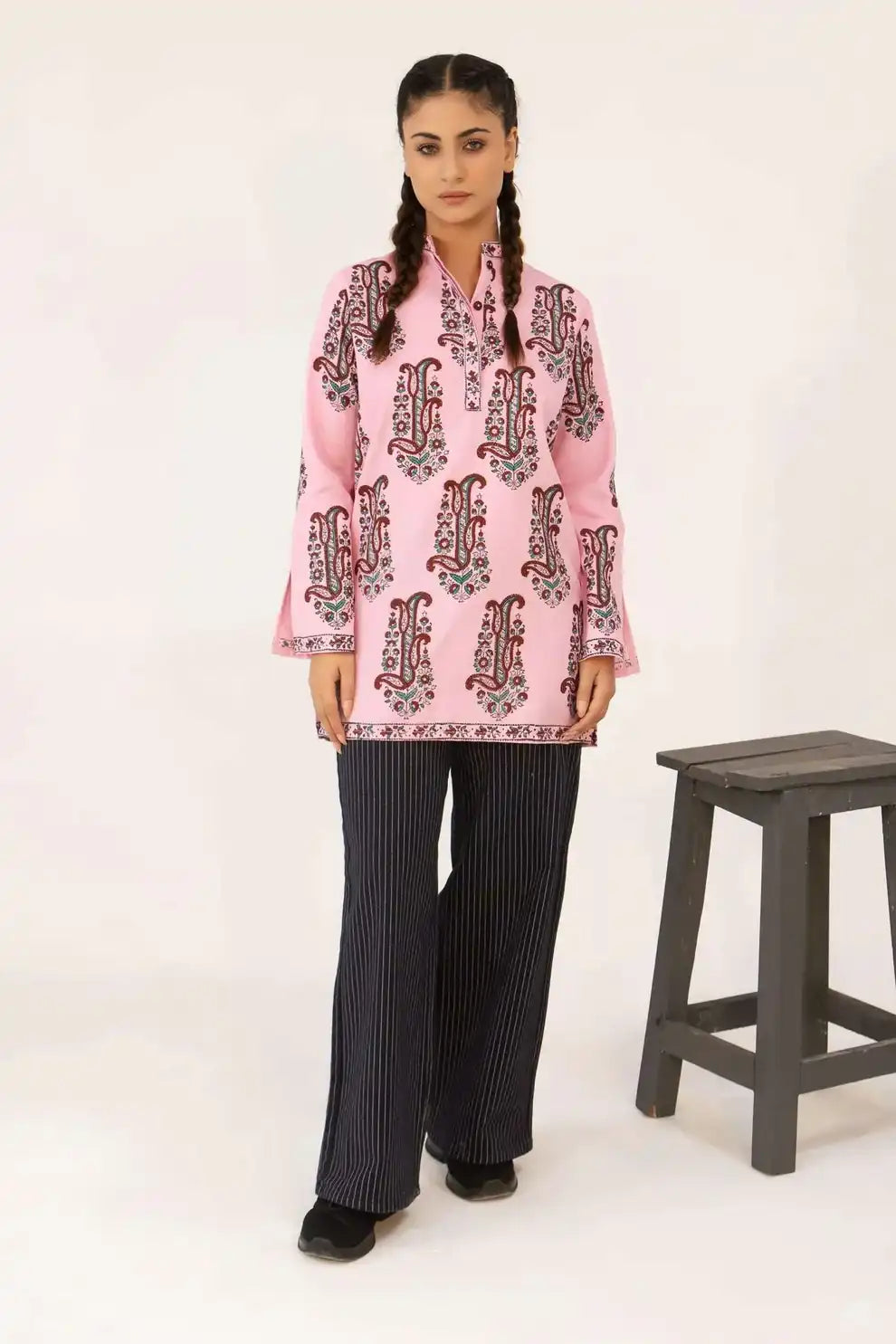 Girl wearing a pink printed kurti tunic 
