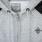 Gray hoodie with Harvage label and black cross emblem on chest