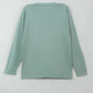 Green long-sleeve shirt