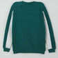 Green sweatshirt with white sleeves on a light gray background