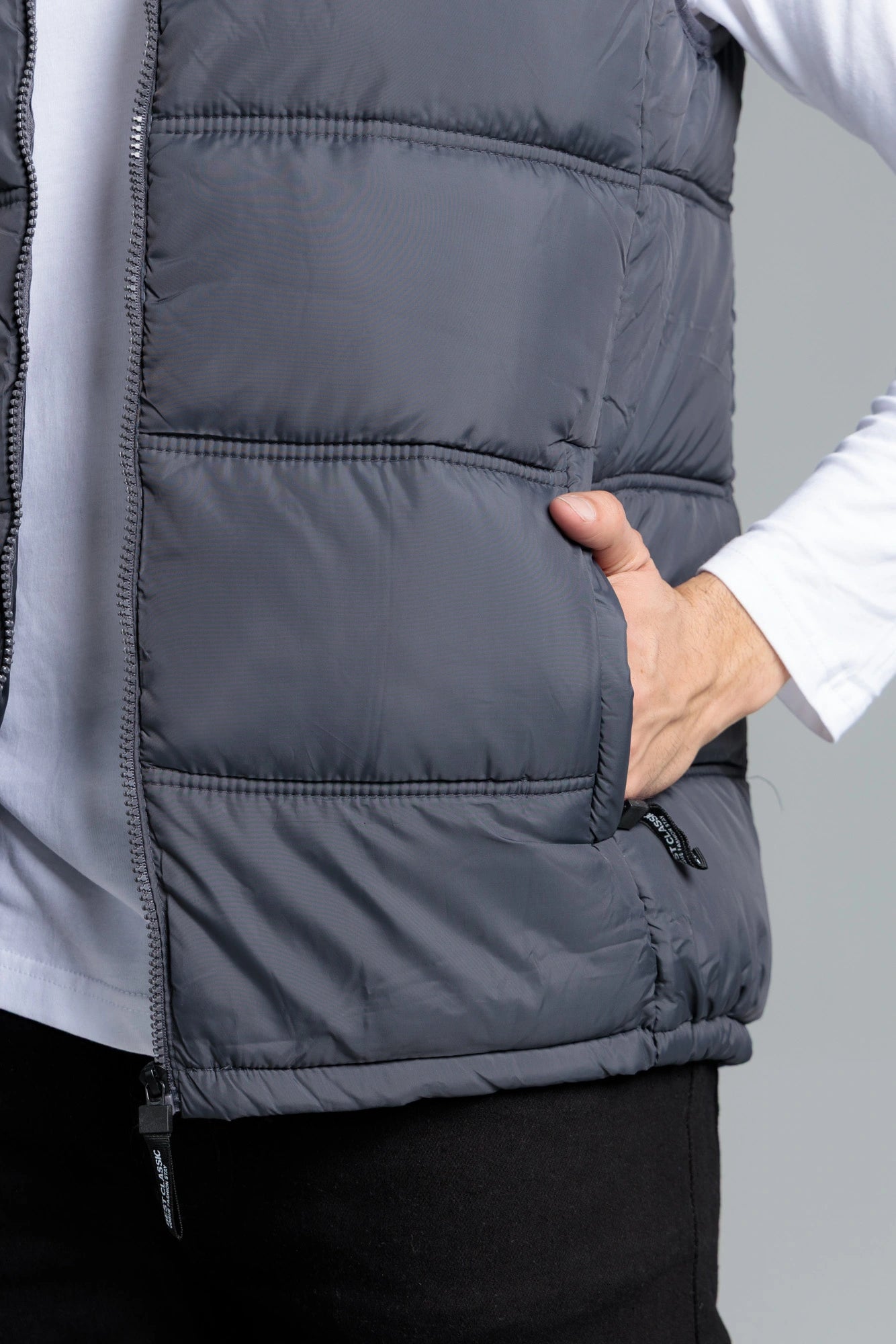 Close-up of grey sleeveless parachute jacket pocket