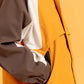 Close-up view of Breaker Jacket in Harvest Gold with front zipper