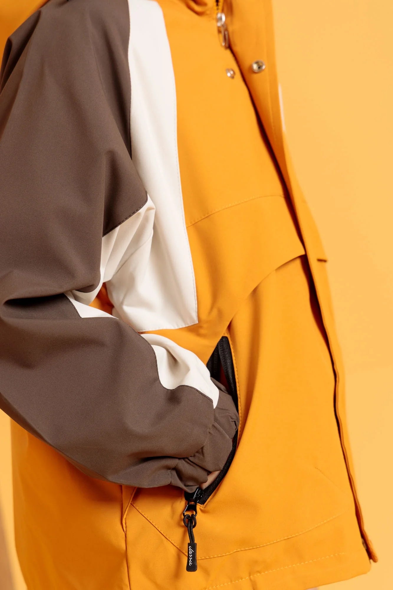 Close-up view of Breaker Jacket in Harvest Gold with front zipper