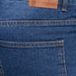 Close-up of blue jeans with a visible brand label