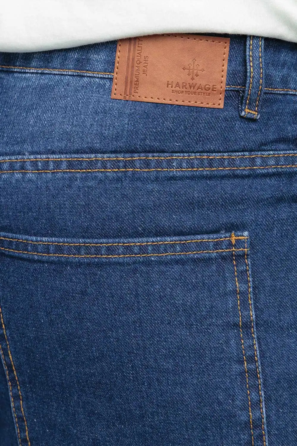 Close-up of blue jeans with a visible brand label