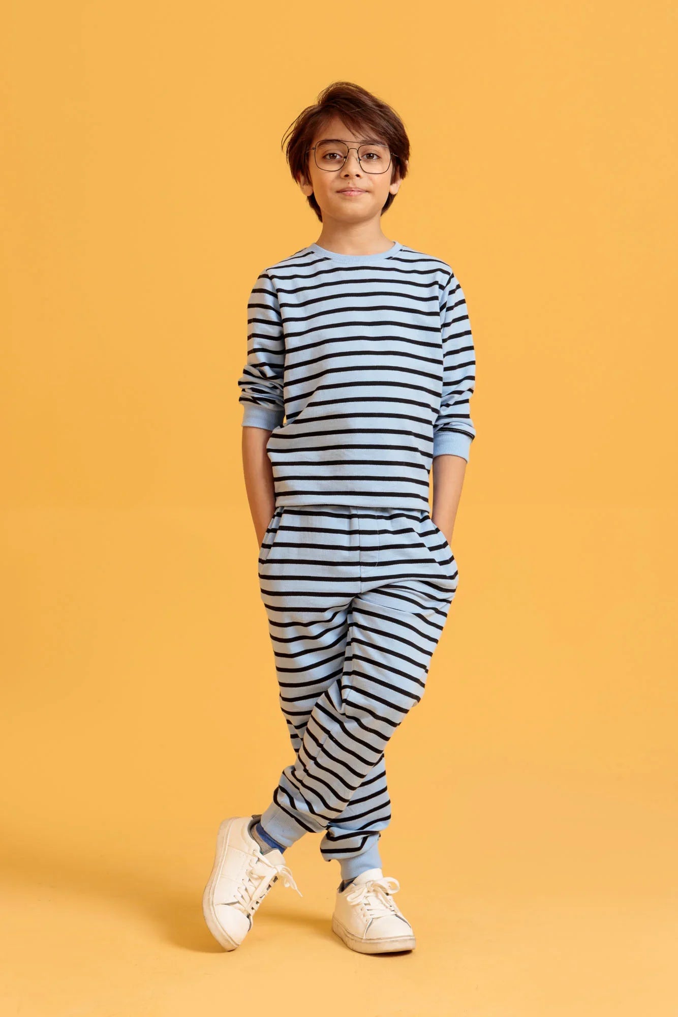 Junior Boys’ Blue Two-Piece Outfit on an orange background