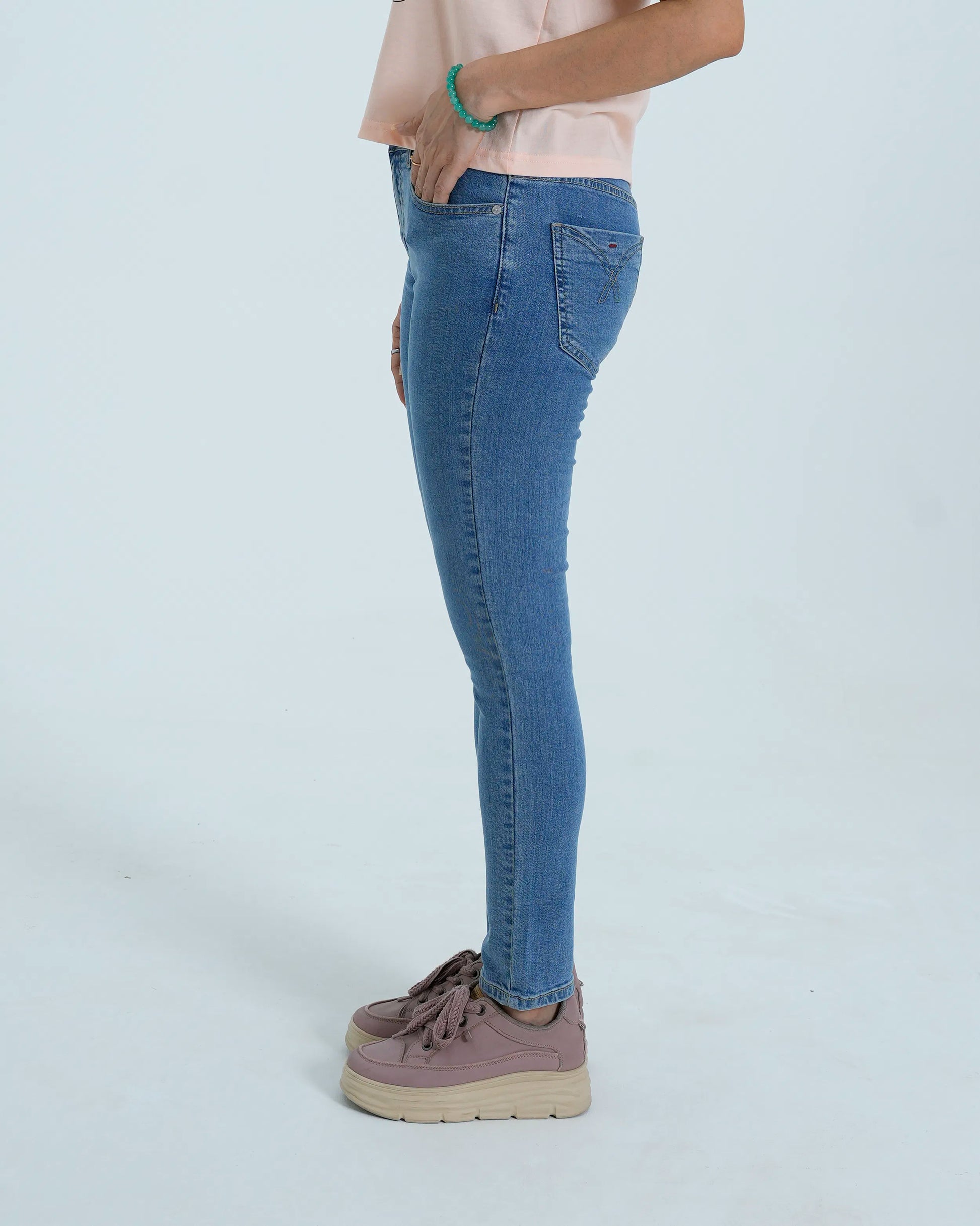 Light blue slim denim side view