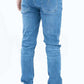 Blue jeans worn by a person on a white background