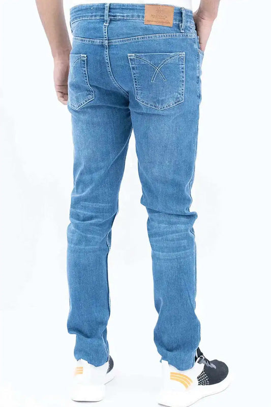 Blue jeans worn by a person on a white background