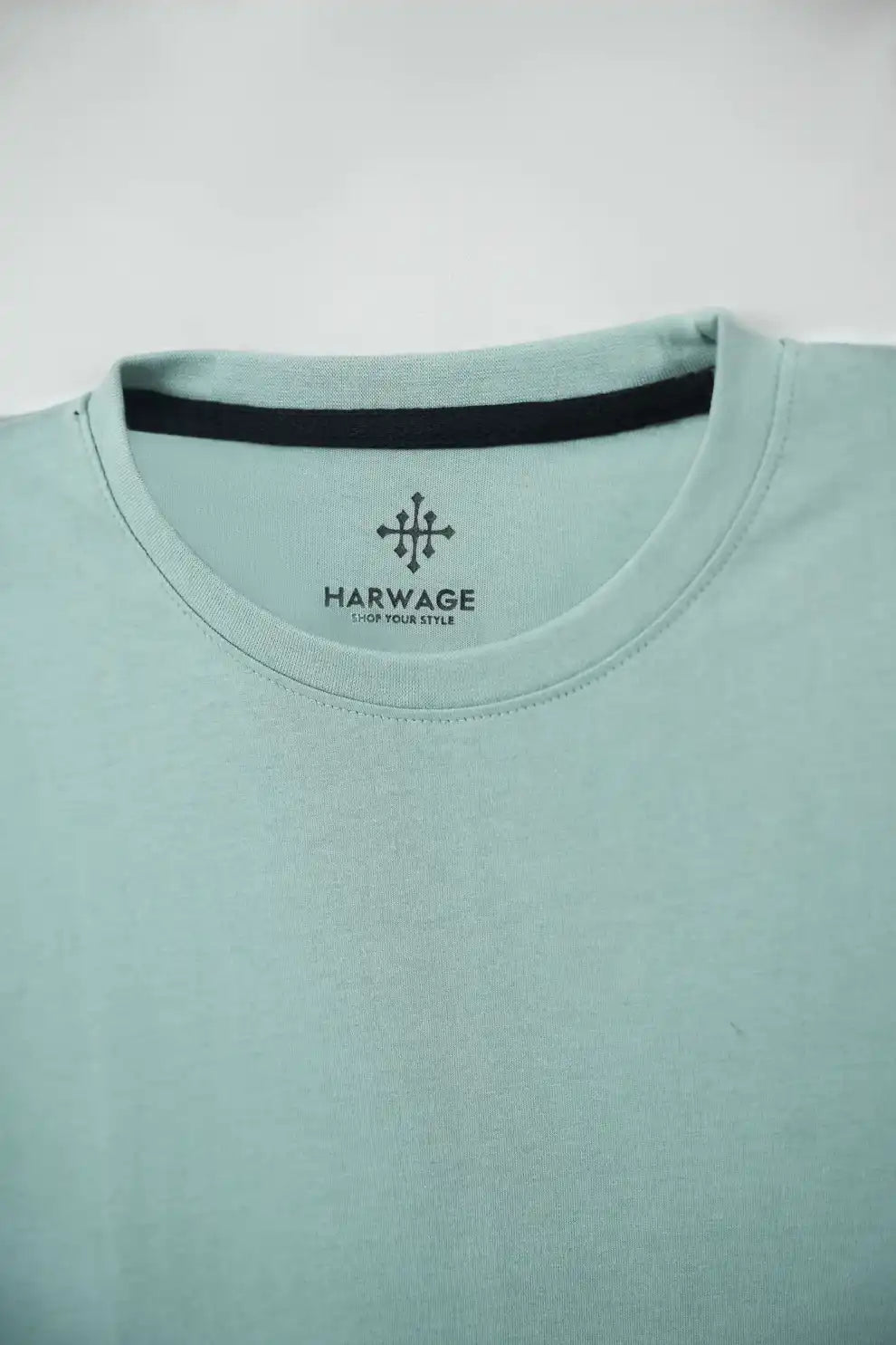 Light blue t-shirt with Har-wage logo 