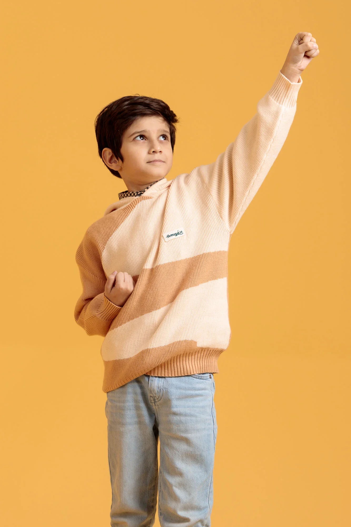Little Boys’ Beige/Brown Wool Pullover with an orange background