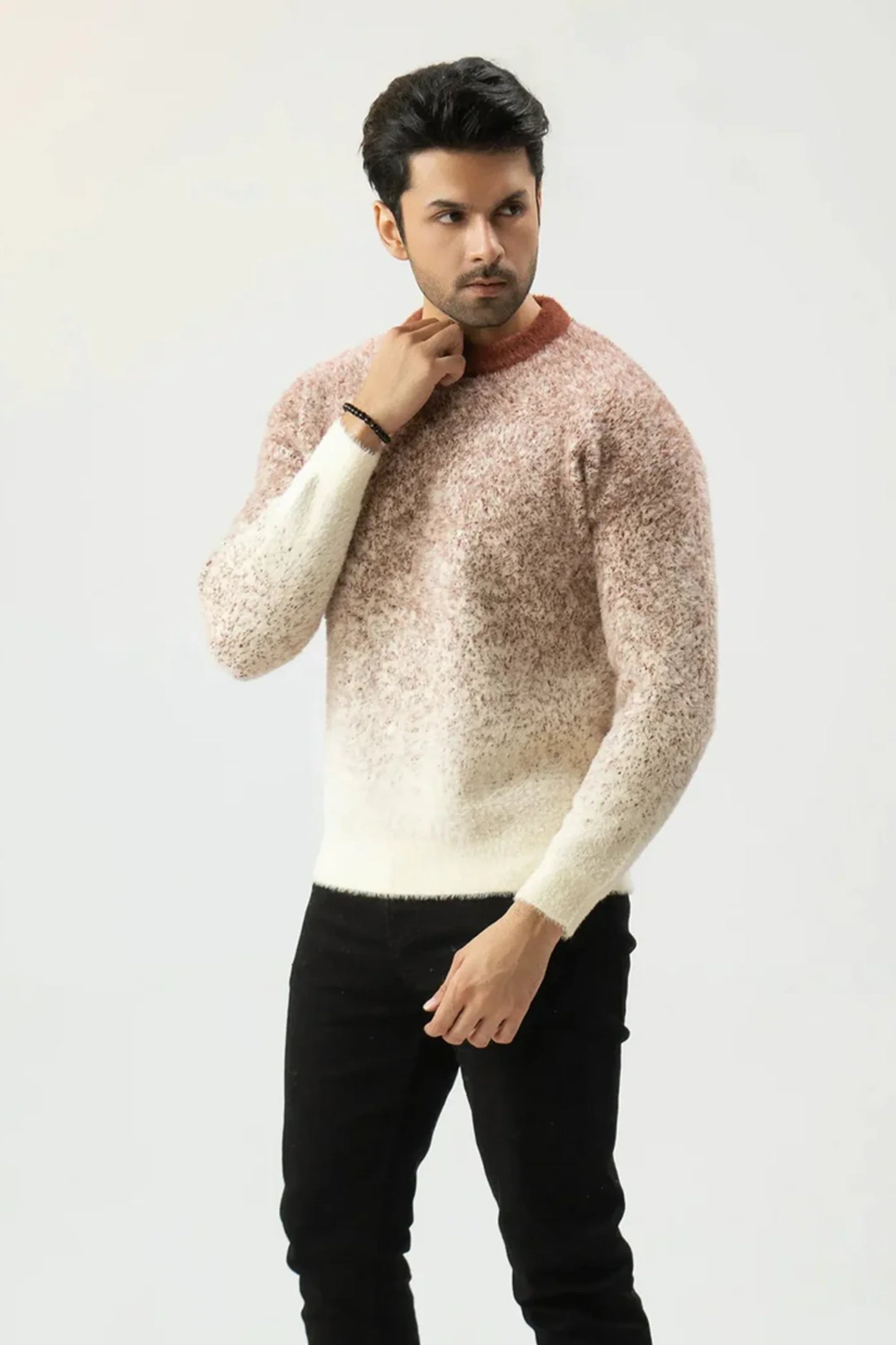 Man in a two-tone sweater with a beige to pink gradient