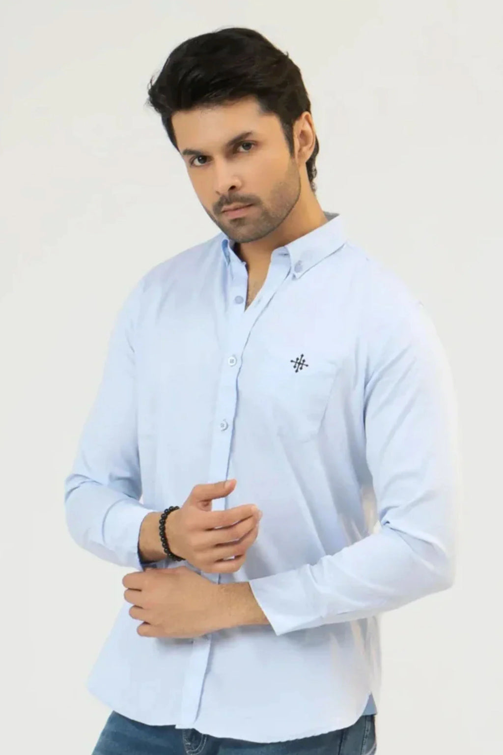 Man wearing a clear sky casual shirt on a white background