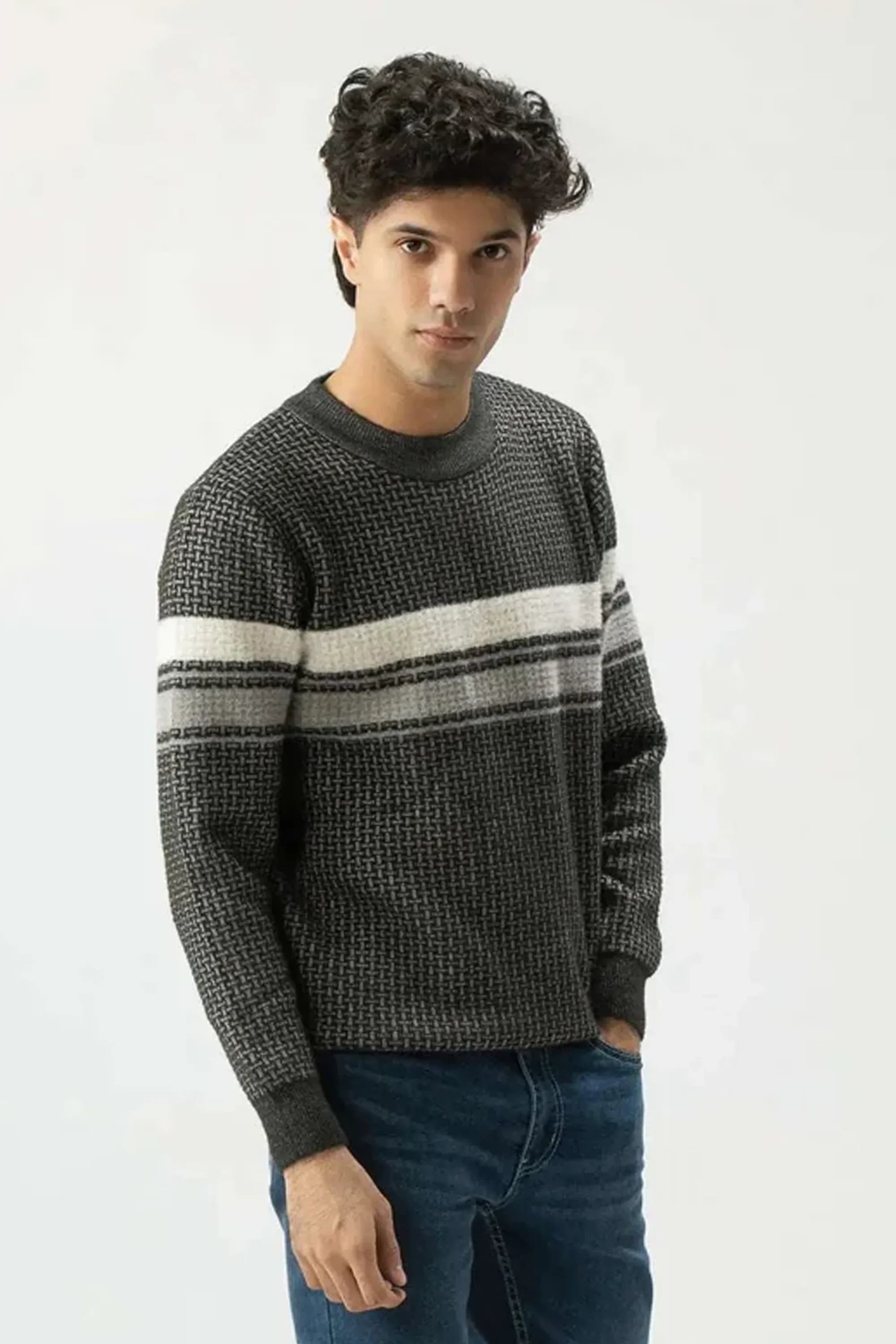 Man wearing a gray sweater with a white stripe on a white background