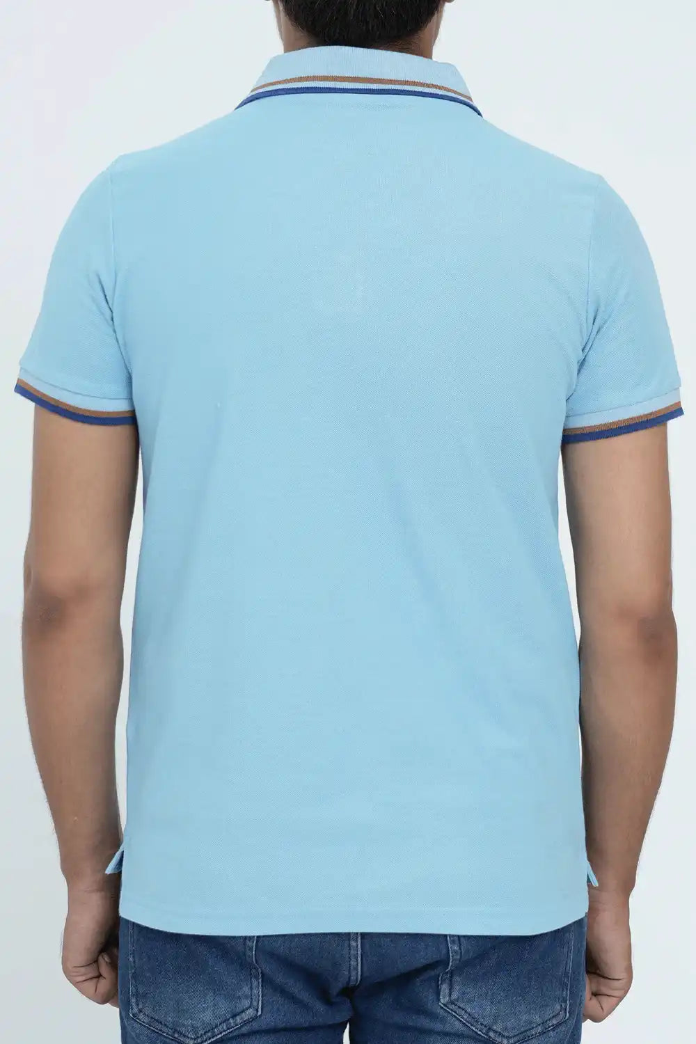 Man wearing a light blue polo shirt 