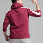 Man wearing a maroon hoodie with white stripes