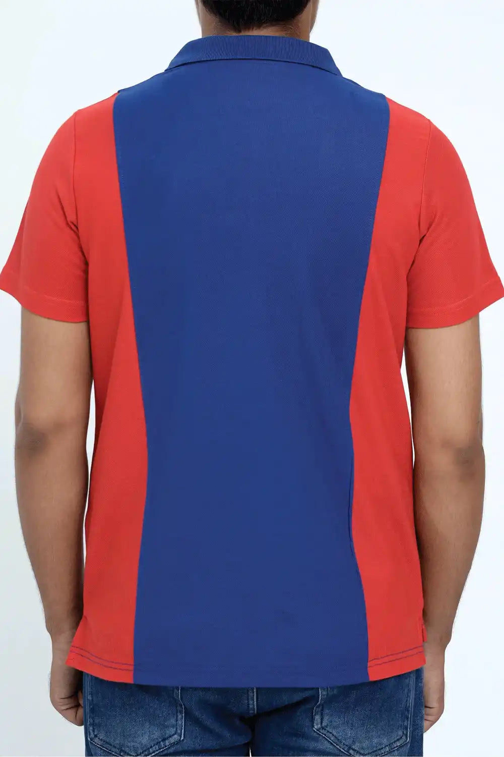 A man wearing a red and blue polo shirt with a white background