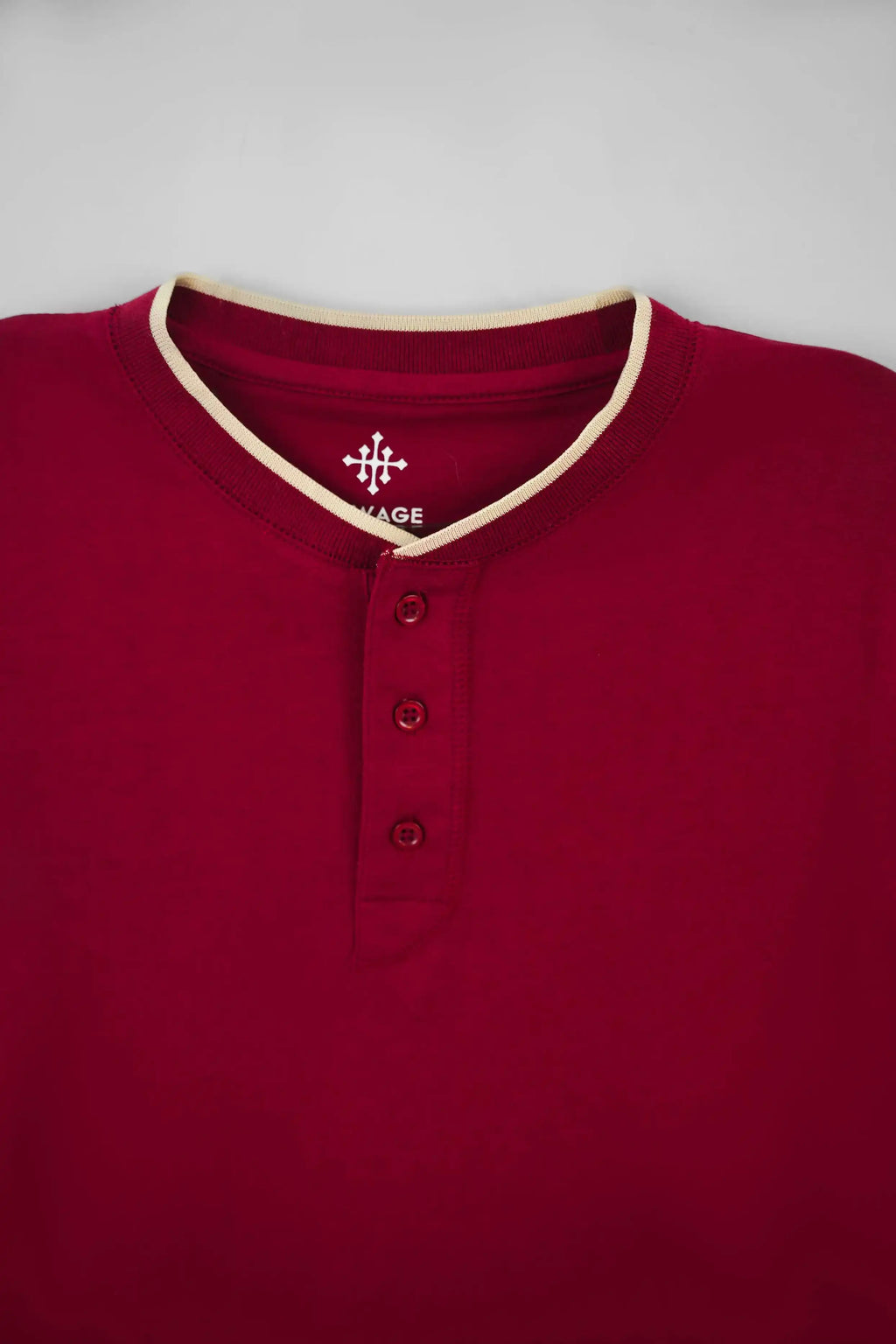 Maroon long-sleeve shirt with beige collar and buttons