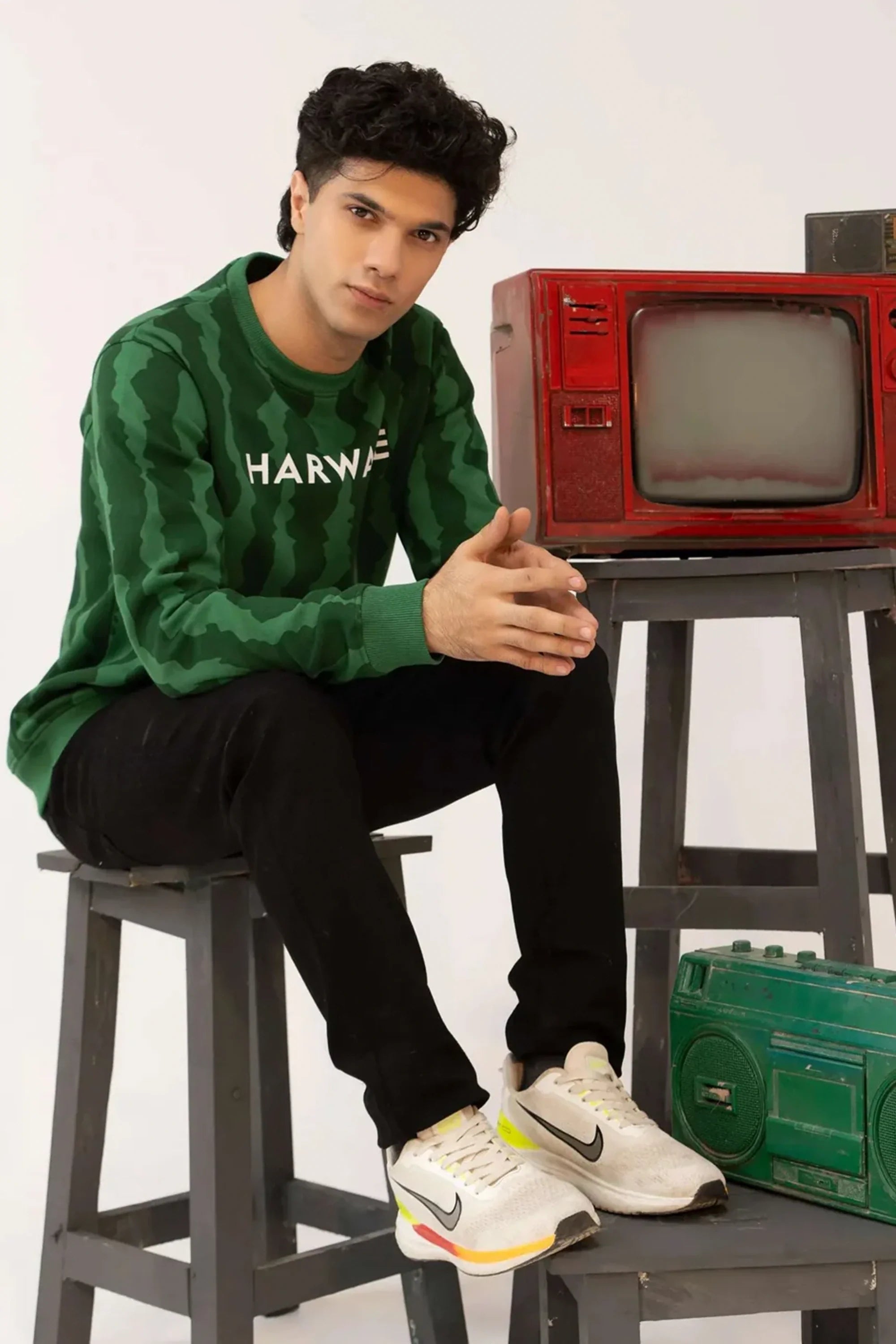 Men green camouflage sweatshirt seated studio pose