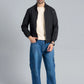 Men’s Black Wind Breaker Jacket paired with a beige t-shirt, blue jeans, and white sneakers