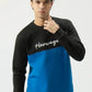Model posing front-facing in Blue Signature Sweatshirt with color-block design