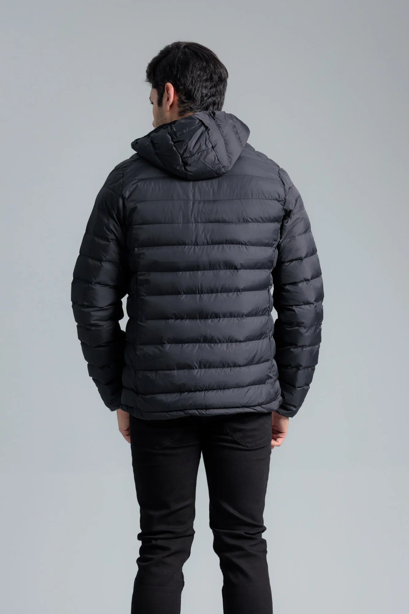 Model posing in a Black Men’s Puffer Jacket for everyday wear