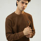 Model facing the camera wearing a Brown Regular Fit Sweatshirt with ribbed texture