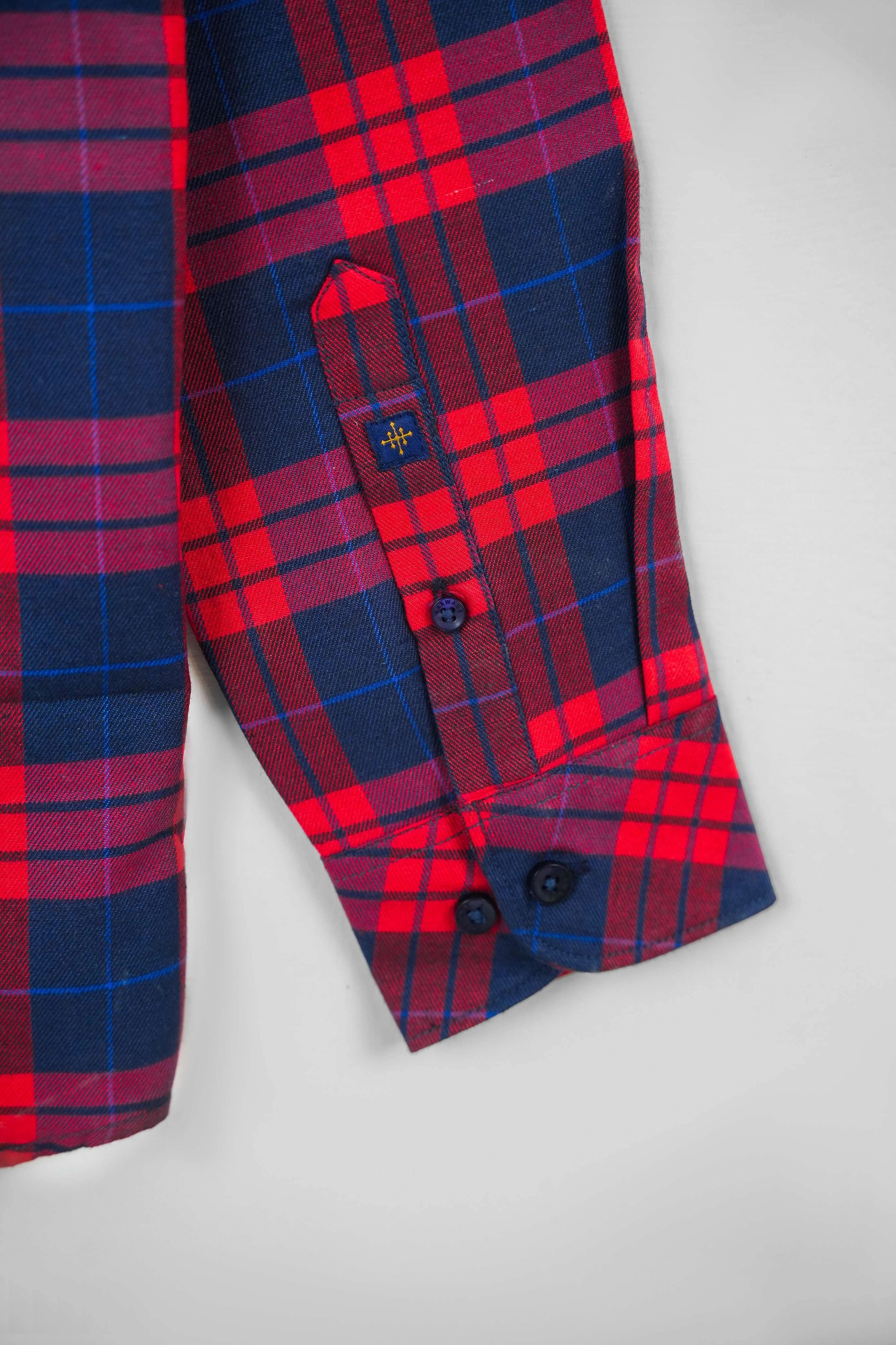 Close-up of multi-color shirt sleeve cuff with red and blue checks