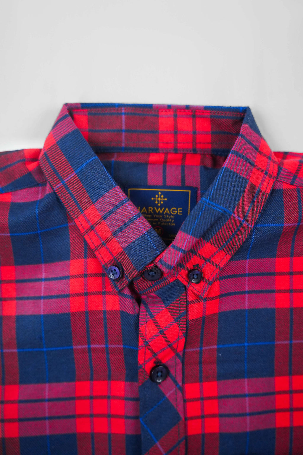 Multi-color shirt showing checked collar and button placket