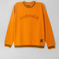  Mustard rib sweatshirt with 'HARWAGE' text