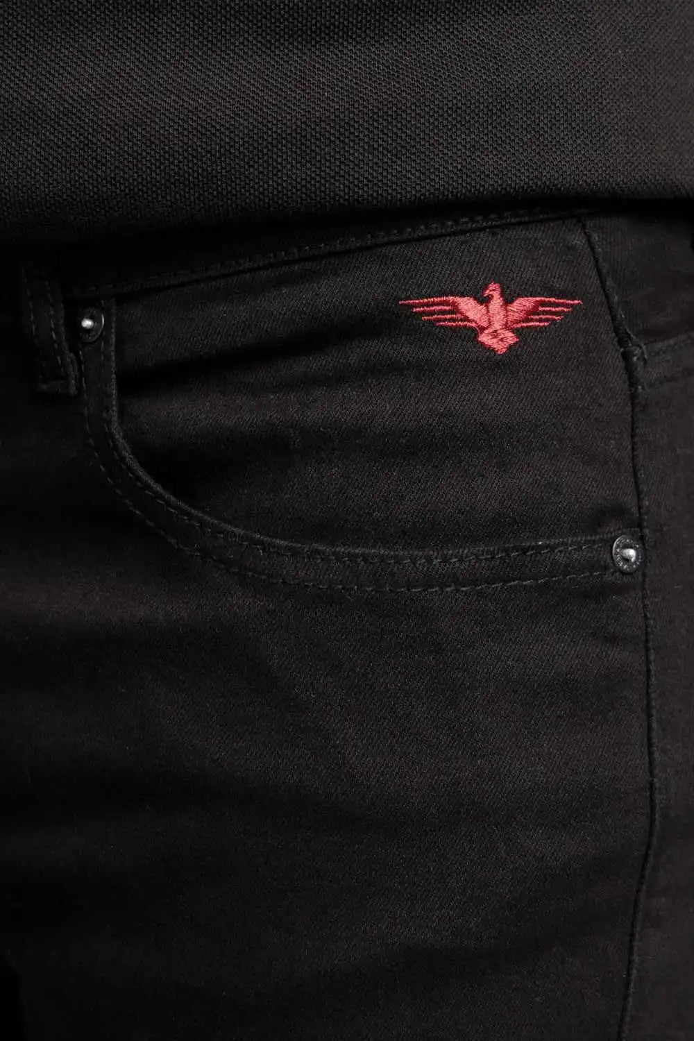 Black pants with a red embroidered eagle design on the pocket