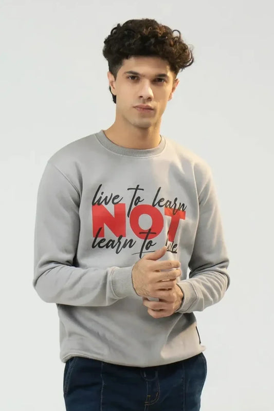 Person wearing a Gray Men Printed Sweatshirt with a motivational quote on a plain background