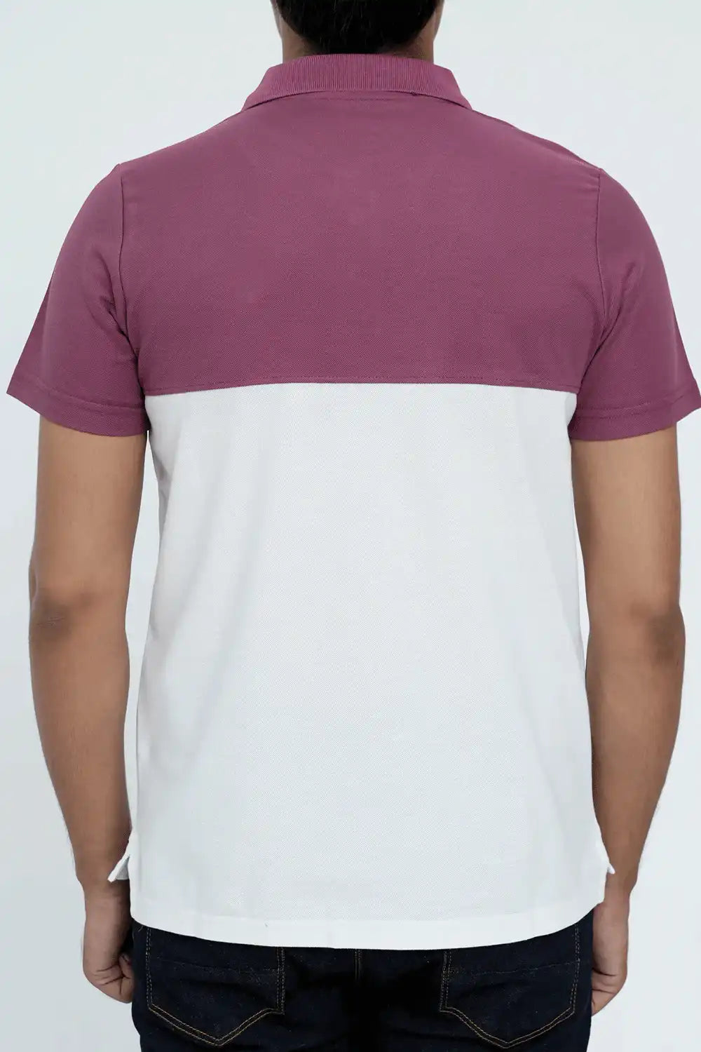 Person wearing a polo shirt with purple and white sections