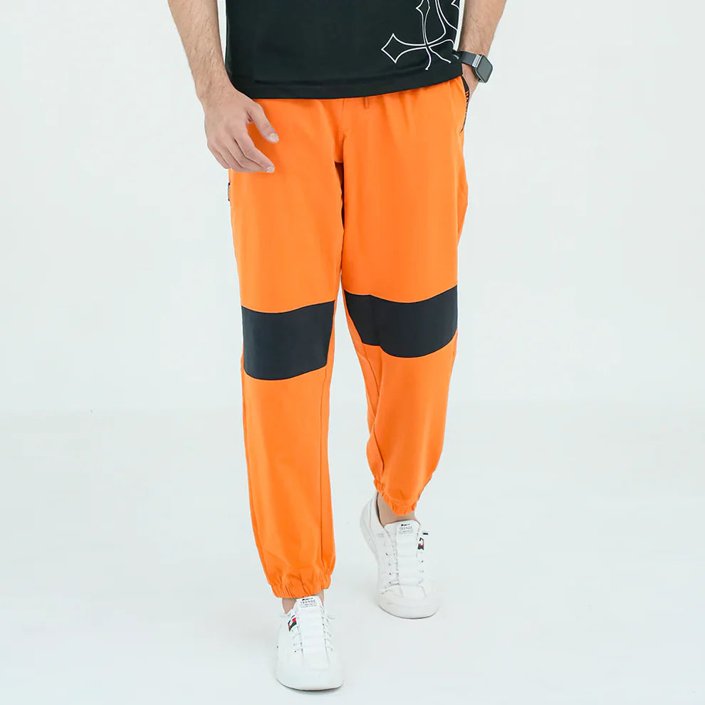 Person wearing bright orange pants 