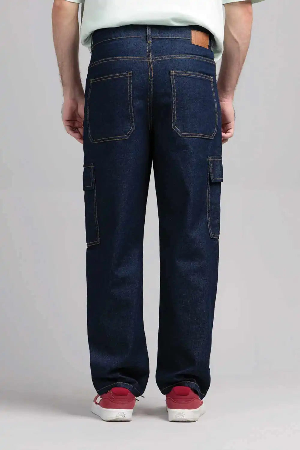 Person wearing dark blue cargo pants 