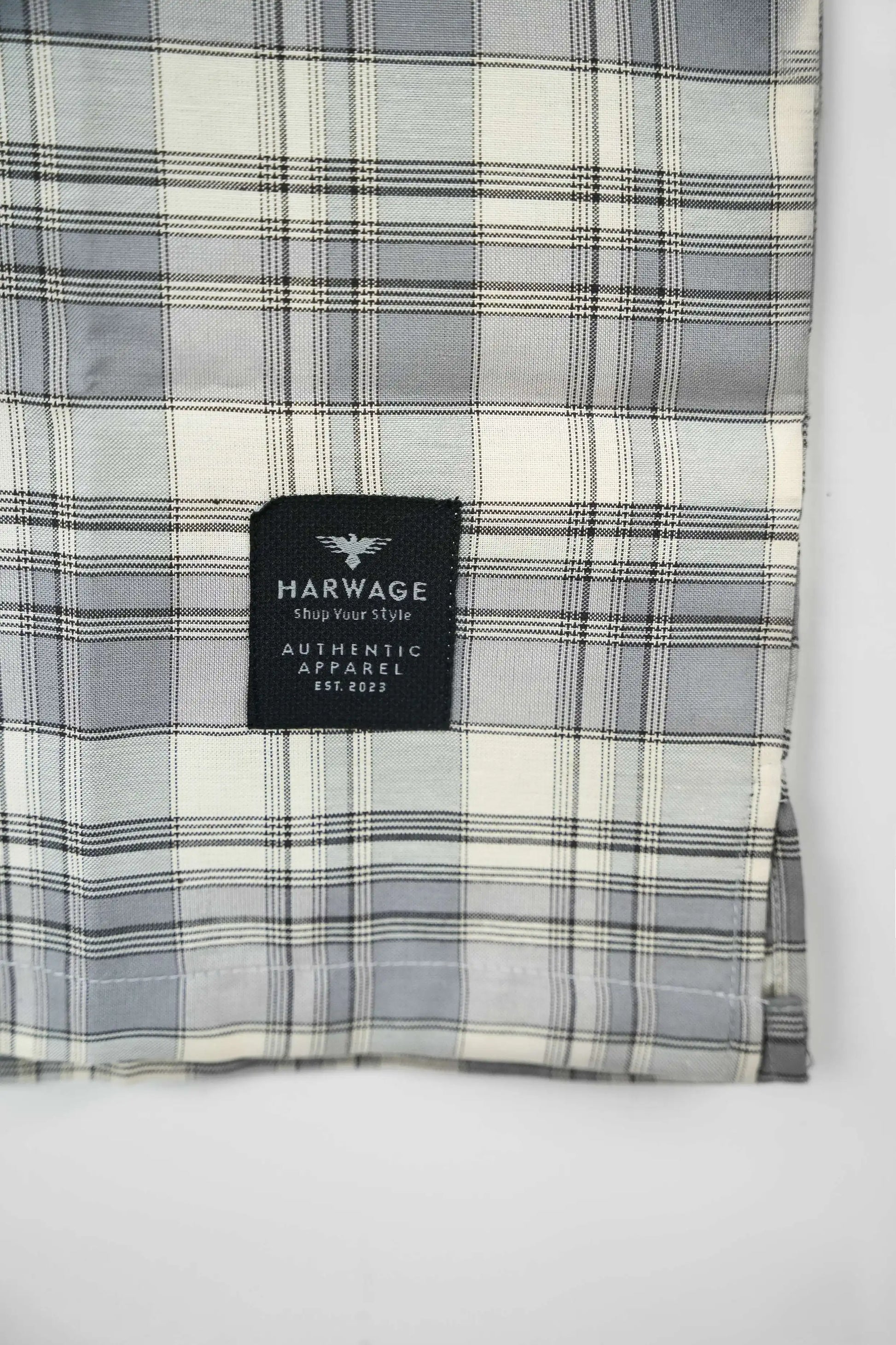 Plaid shirt with a Harwage brand label 